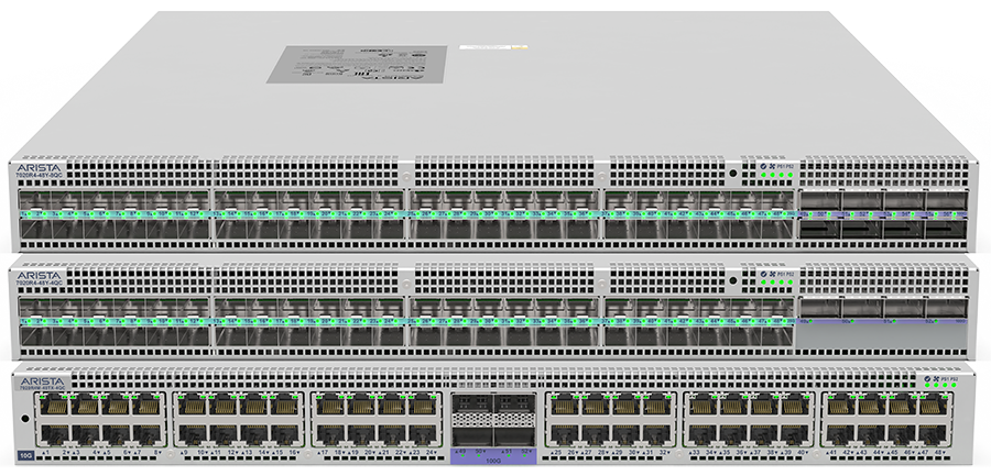 Three stacked Arista data-center switches, two fibre and one copper, port numbering readable across the front